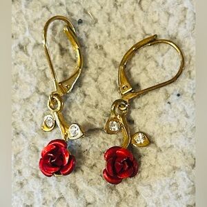 Vintage gold-tone red rose dangle earrings featuring clear rhinestone accents